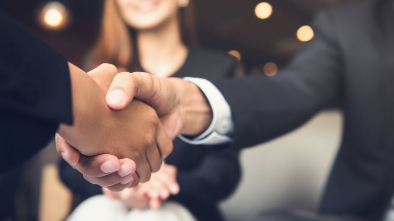 two people shaking hands