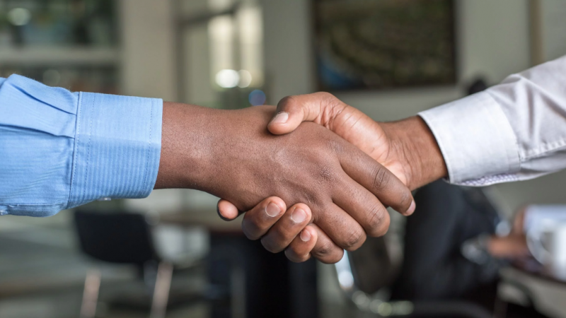 Sales decision makers shaking hands