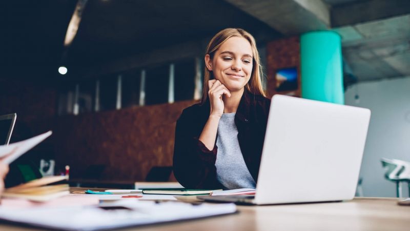 woman watching video on laptop