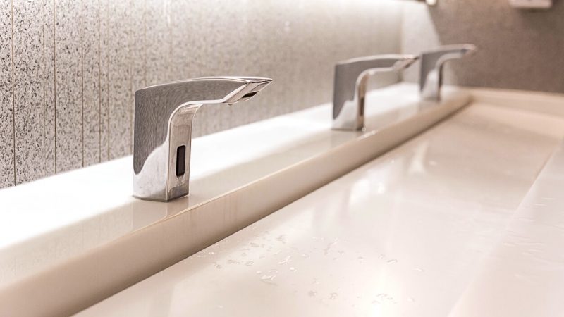 touchless faucets in hotel bathroom