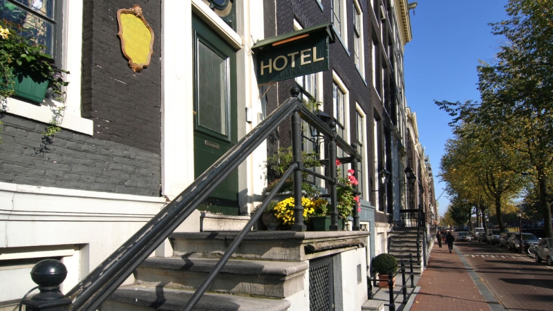 Exterior view of entrance of small hotel