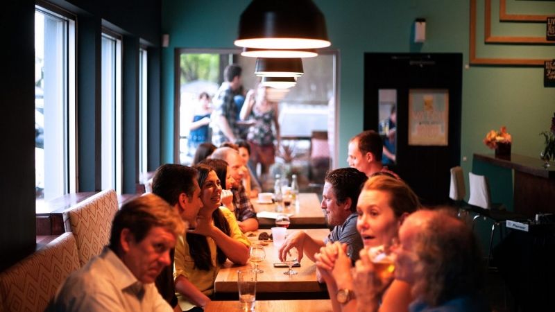 people sitting talking at a hotel restaurant